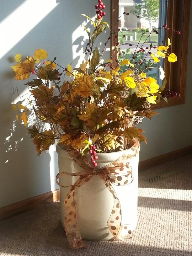 Faux flower seasonal change with ribbons and berries