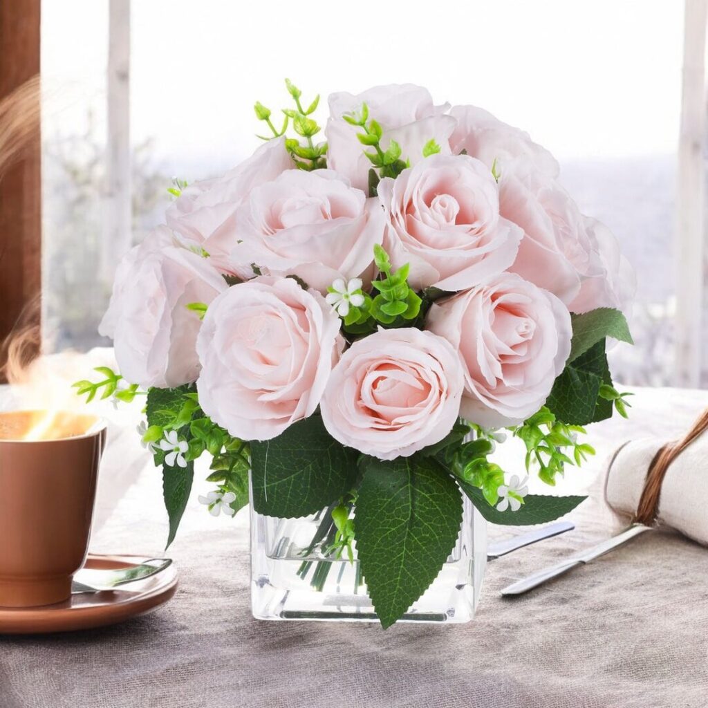 Faux roses in small glass vase