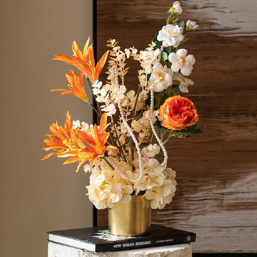 resin and metal home decor with faux flower arrangement