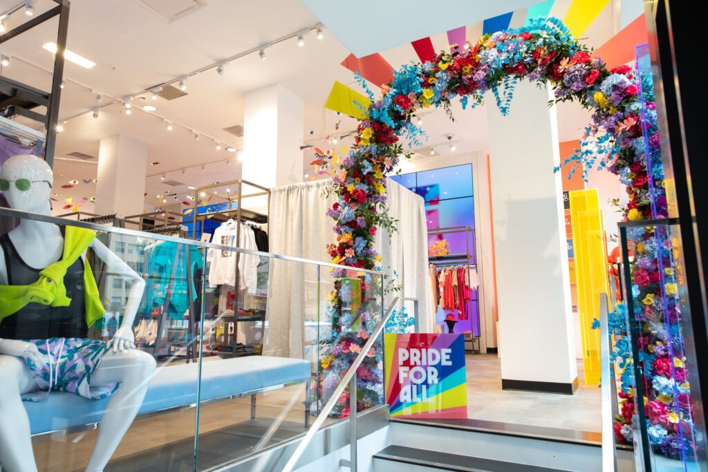 ![faux floral arch in clothing store](https://placehold.co/600x400 "faux floral arch in retail clothing store for seasonal promotion")  