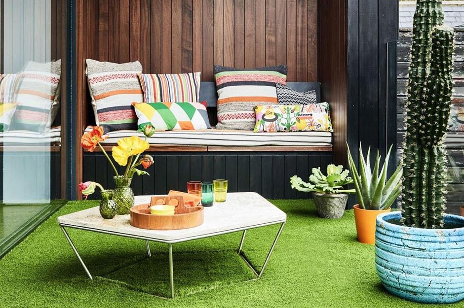faux floral balcony arrangement with cushions