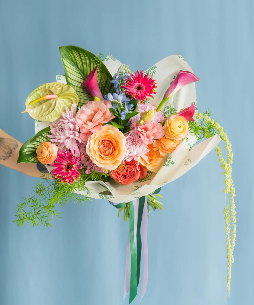 neutral background behind bright faux bouquet