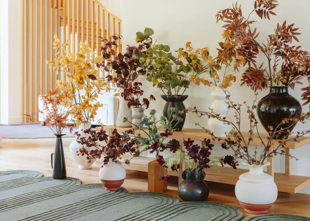 dusty artificial flowers in retail display before cleaning