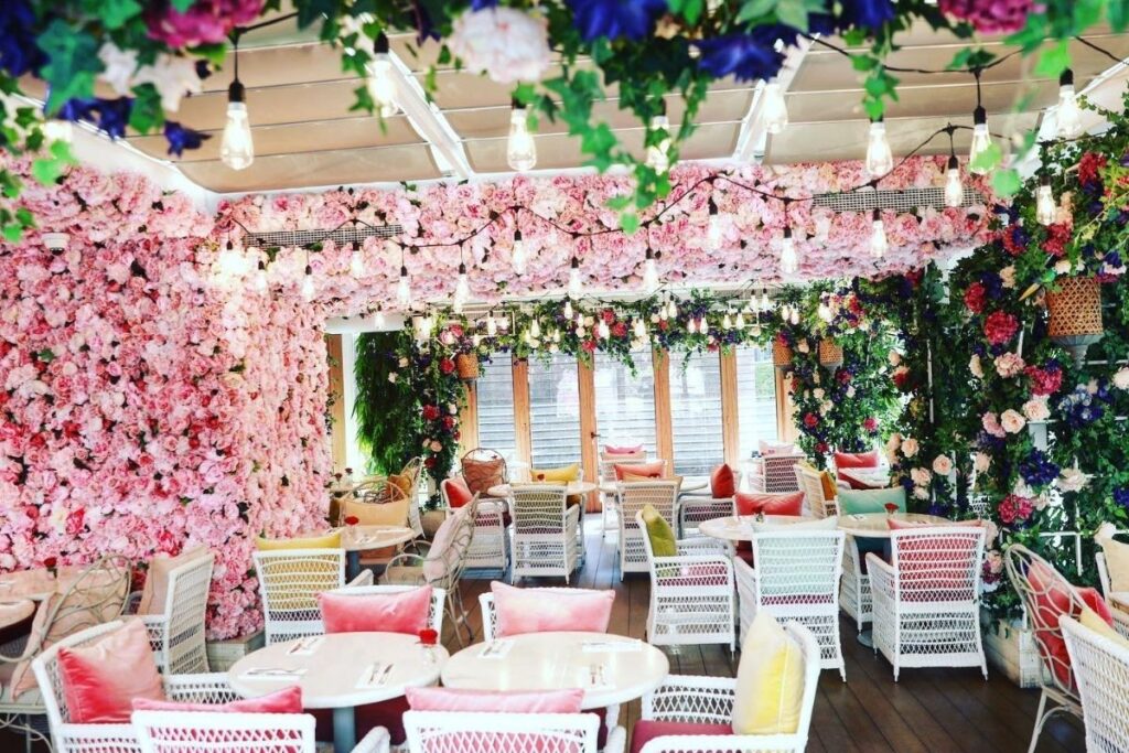 Fake flowers Dubai mall terrace and outdoor cafe