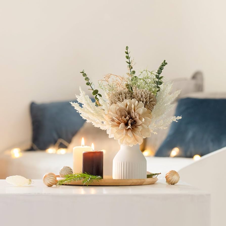 artificial flowers in a small vase artificial flowers in a small vase