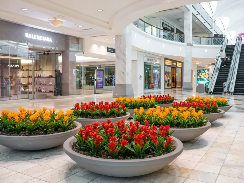 business artificial flowers in planter for hotel retail and events