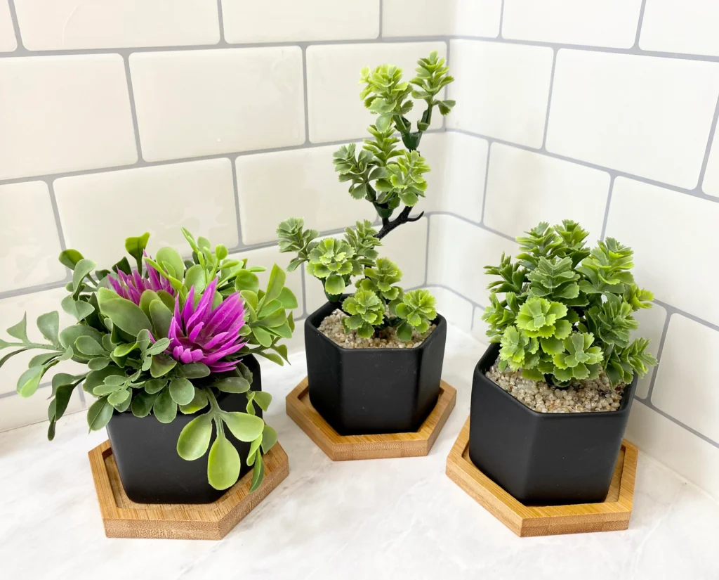 fake looking potted artificial plants with poor pot filler and weak base