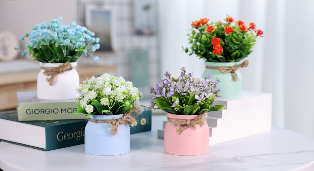modern artificial flowers in planters for interior decoration