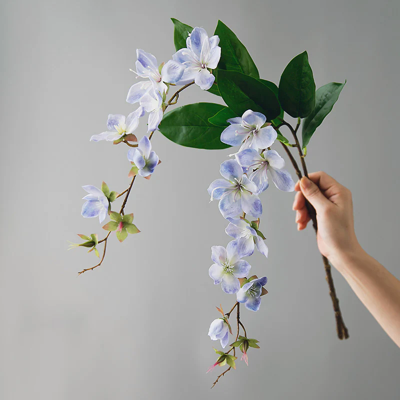 why do artificial flowers look fake because of stiff stems flat leaves and plastic branches