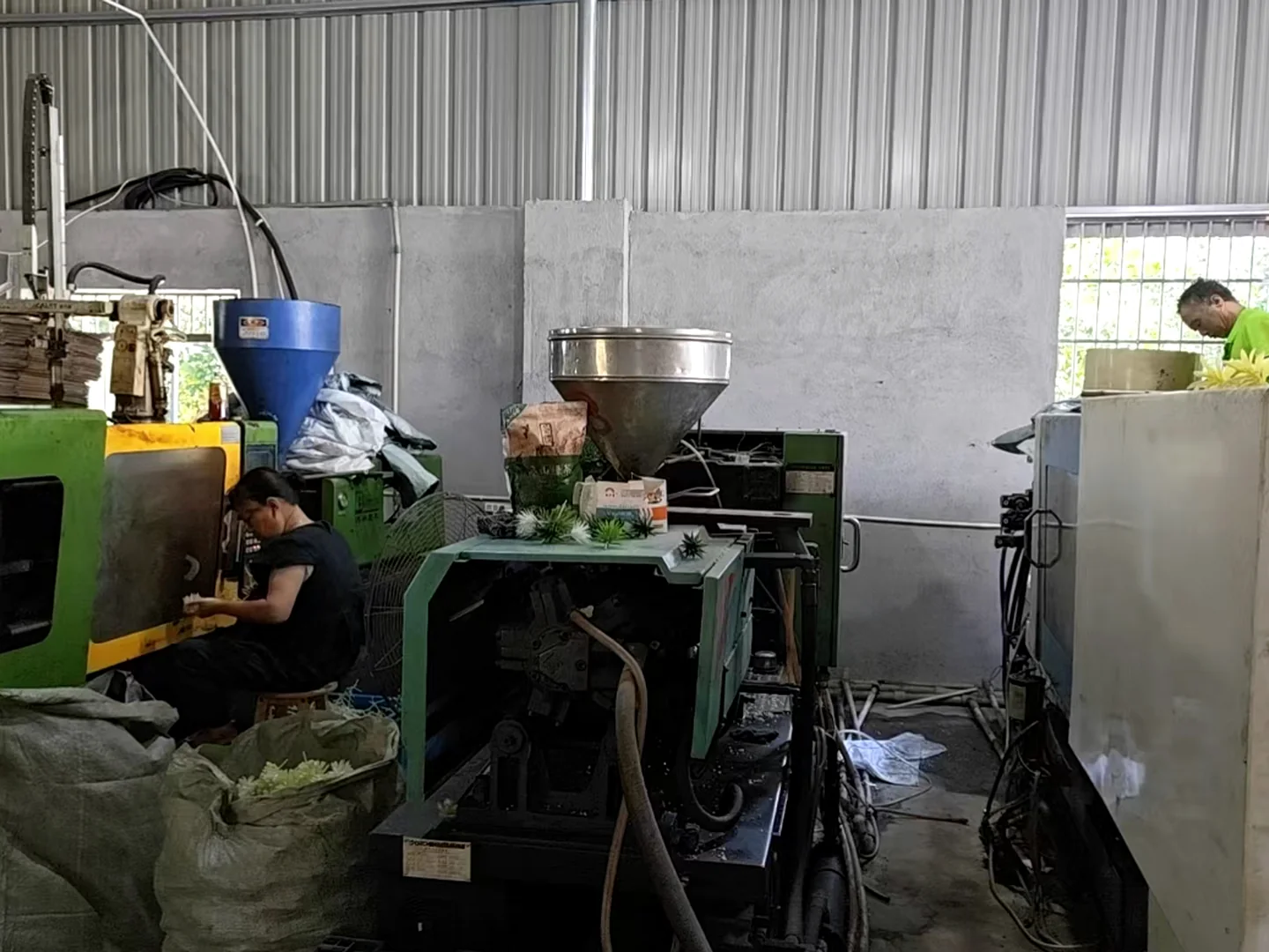 Plastic injection molding workshop producing artificial cactus and succulent components