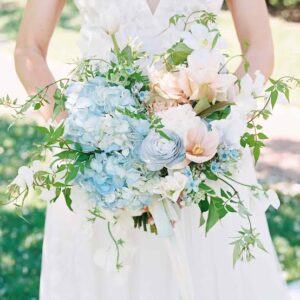 arranging focal flowers fillers and greenery in artificial wedding bouquets