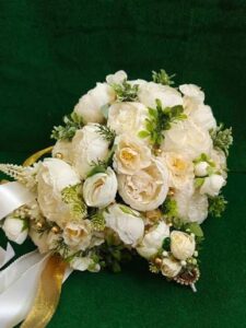 arranging main flowers fillers greenery in silk flower wedding bouquet