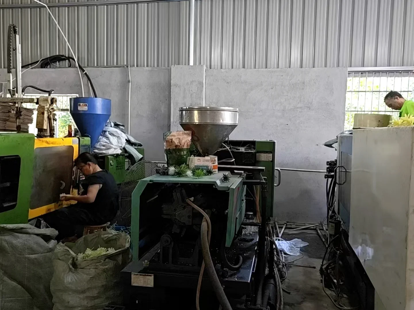 Plastic injection molding workshop producing artificial cactus and succulent components