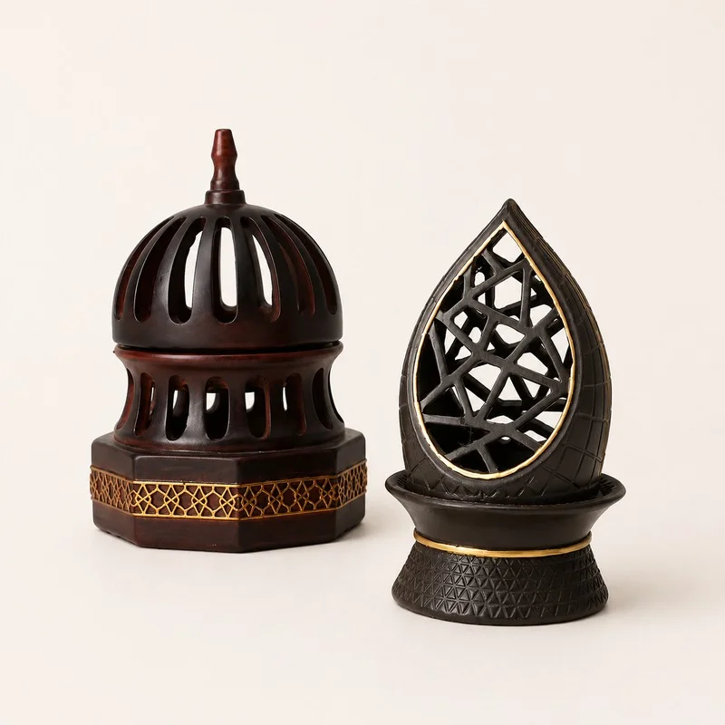 Dark resin decorative ornament pair