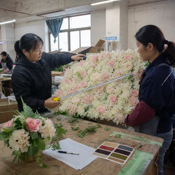 Quality inspection of an artificial wedding flower wall in a Chinese factory