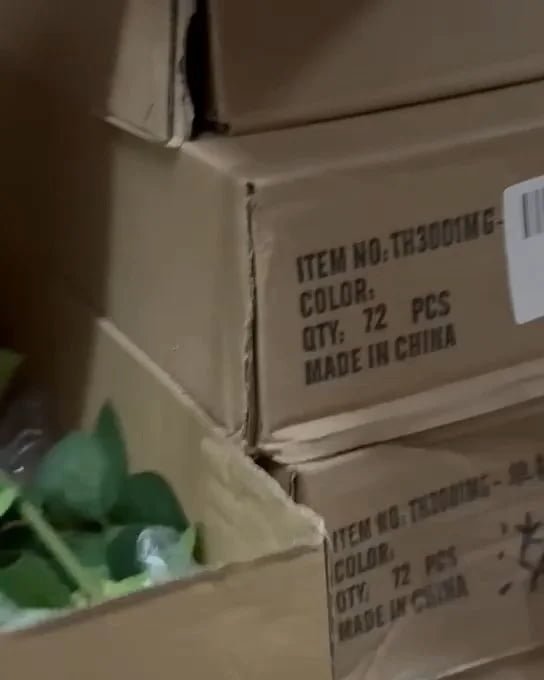 Export cartons of artificial flowers labeled with item number, color and quantity