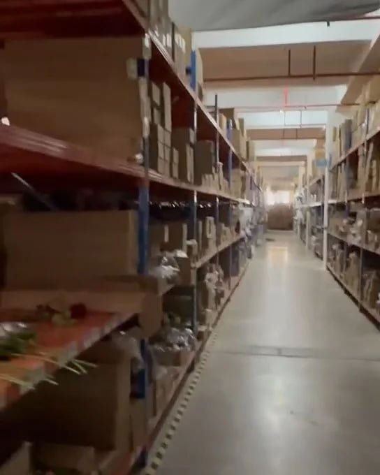 Shelves of boxed artificial flowers in the Botanicblossoms warehouse
