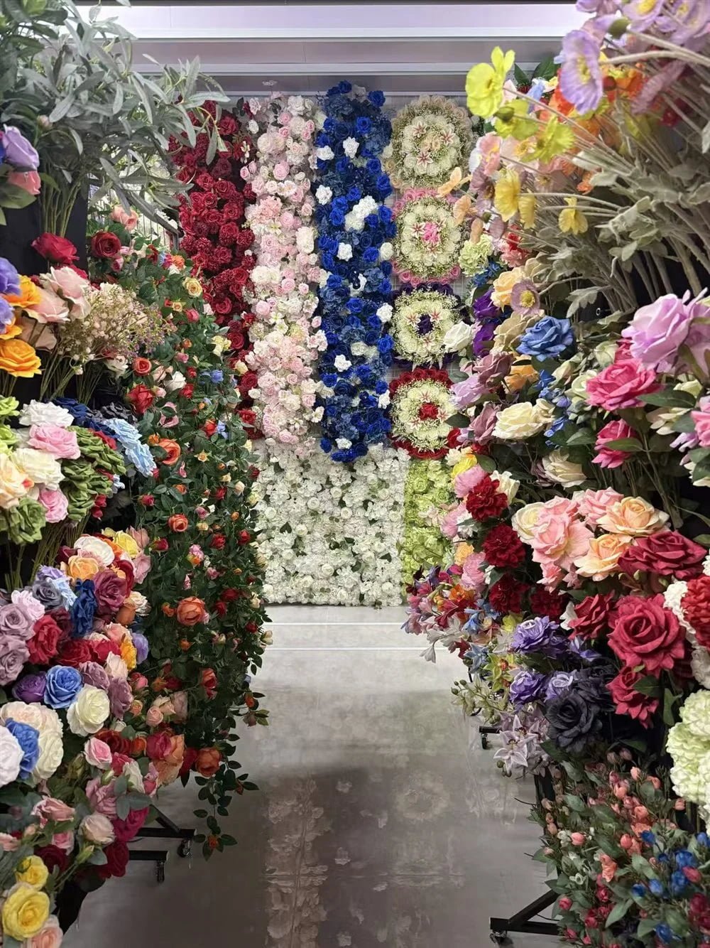 Rows of artificial flower walls in several colors in the Botanicblossoms showroom