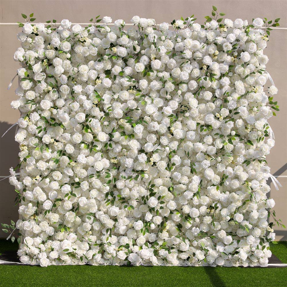 White rose artificial flower wall with green leaves